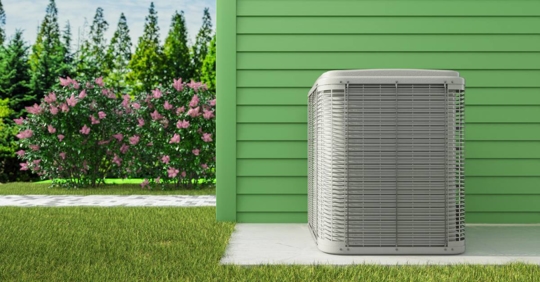 heat pump outdoor unit at the back of the house